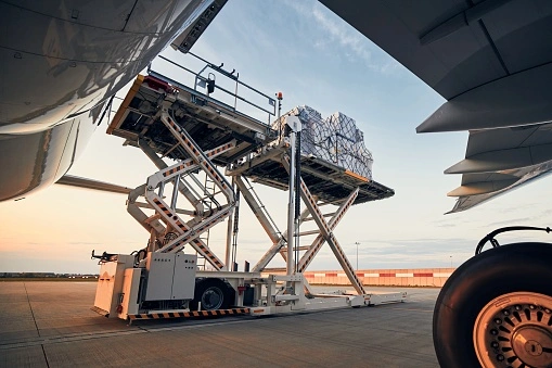 Air parcel cargo being loaded onto a plane for international shipping from Calgary, Canada to Finland, Europe