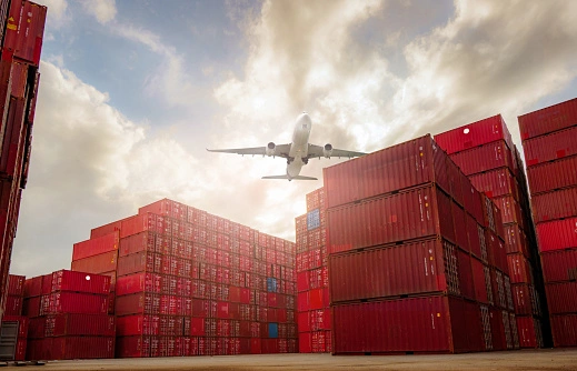 Sea containers and cargo plane for international shipping, offering both sea and air cargo transportation options